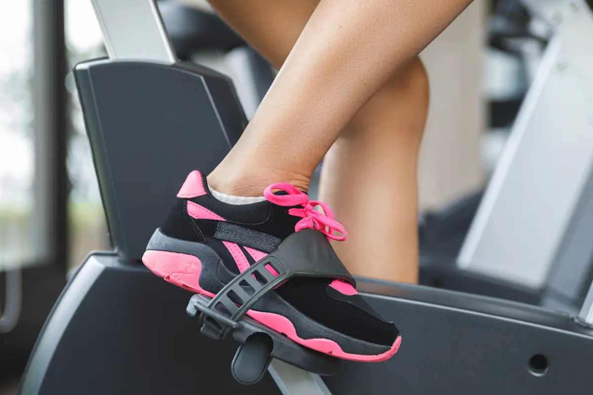 Feet in stationary bike pedals