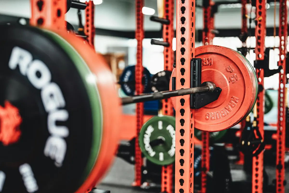 Loaded barbell on a squat rack