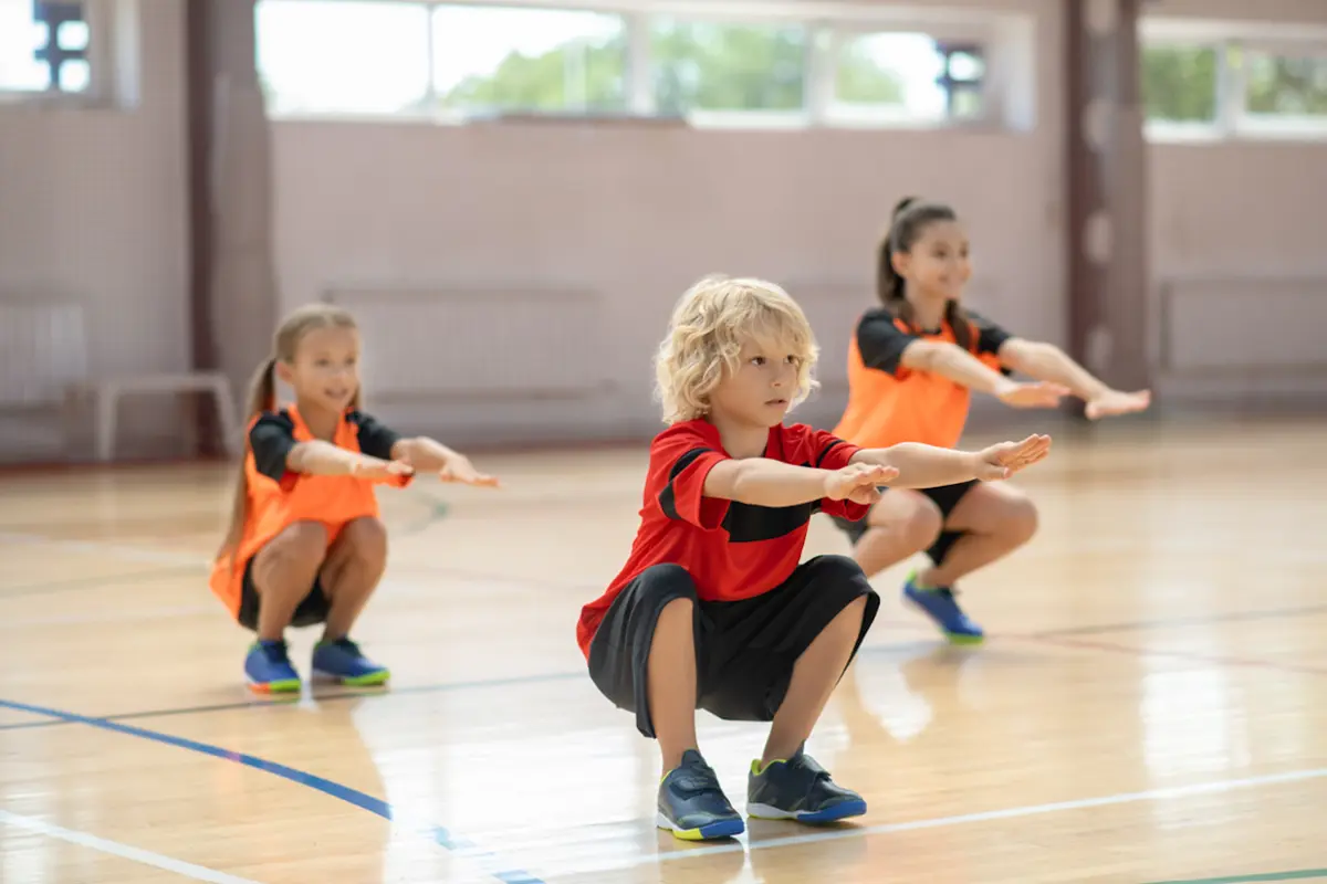 Children doing bodyweight squats
