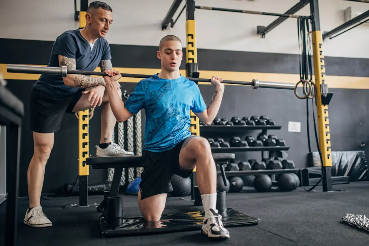 Boy being coached with a